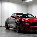 A finished, gleaming car under showroom lights 128x128